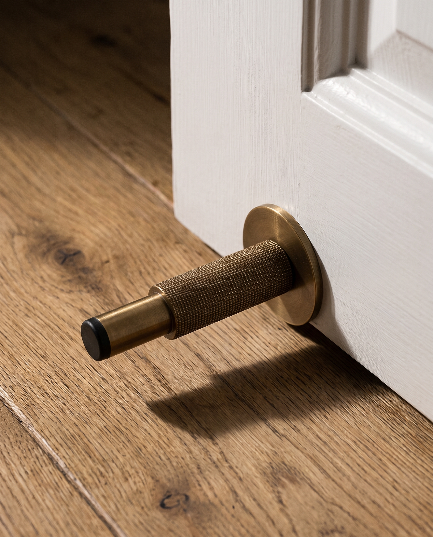 Ritmo Knurled Brass Door Stop