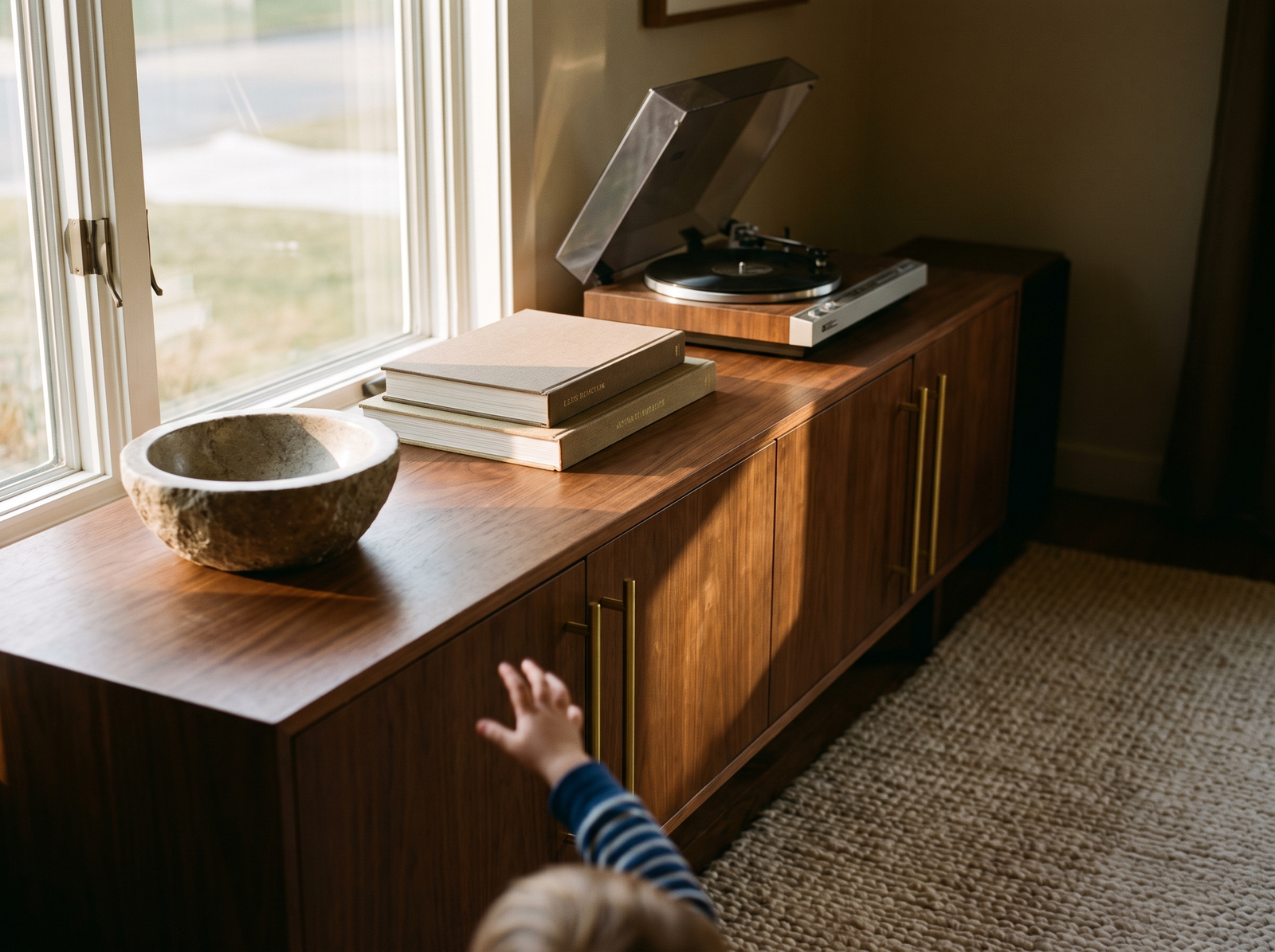 Sofina brass hardware in a warm living room